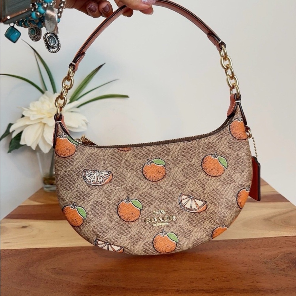 COACH Authentic limited edition orange mini Peyton bag